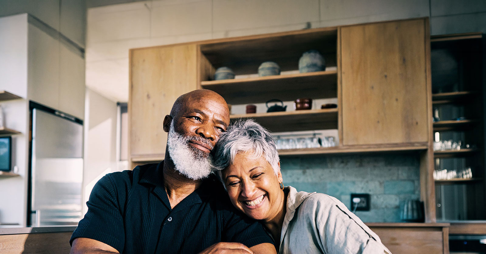 Happy couple enjoying a joyful moment together at home.
