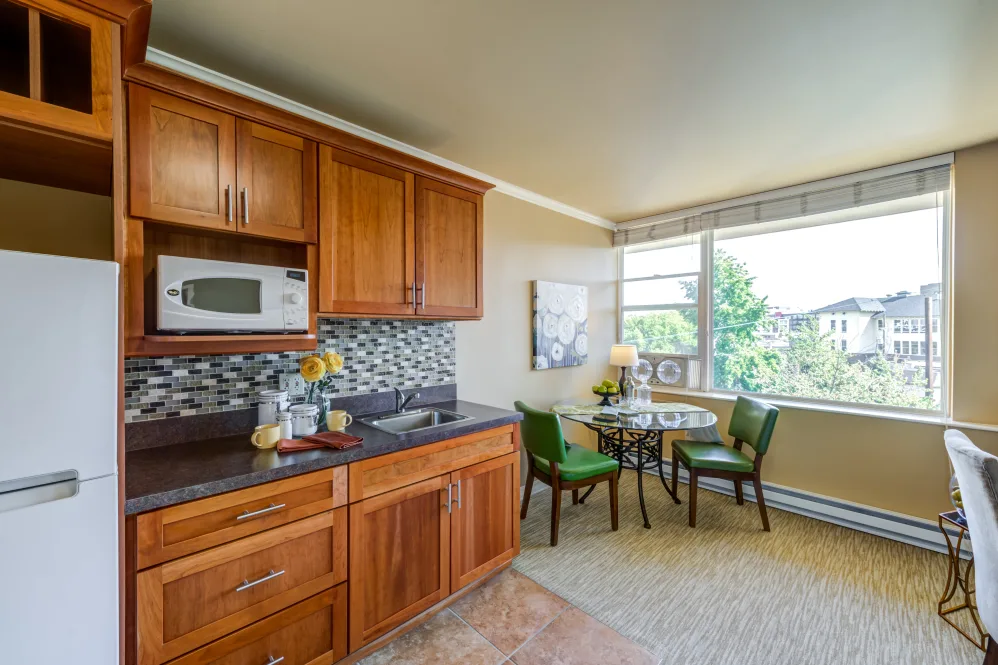 Cozy kitchen with dining area and natural light.
