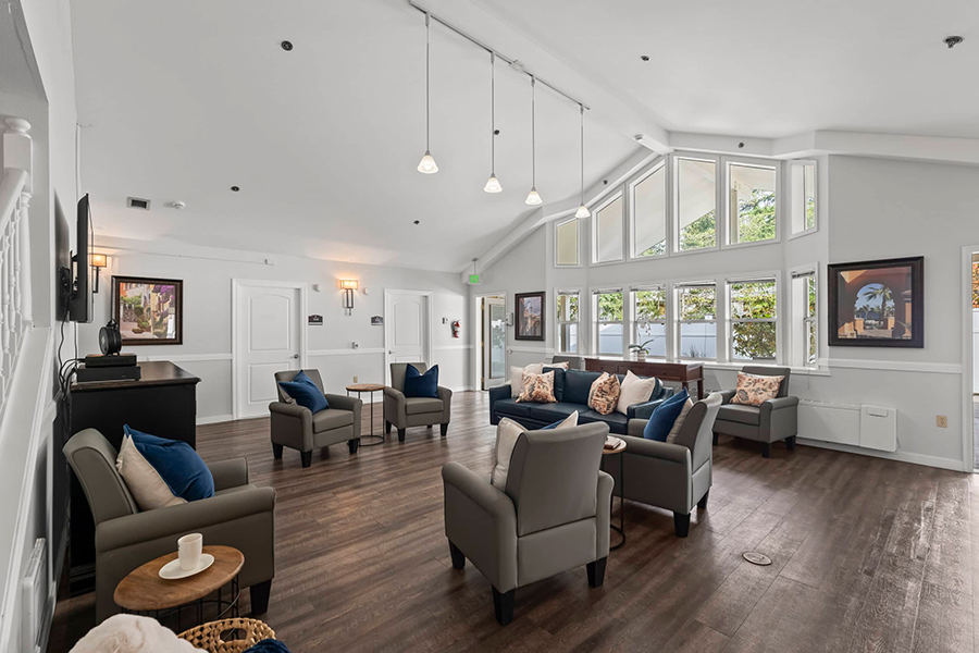 Bright, modern lounge with comfortable seating and large windows.