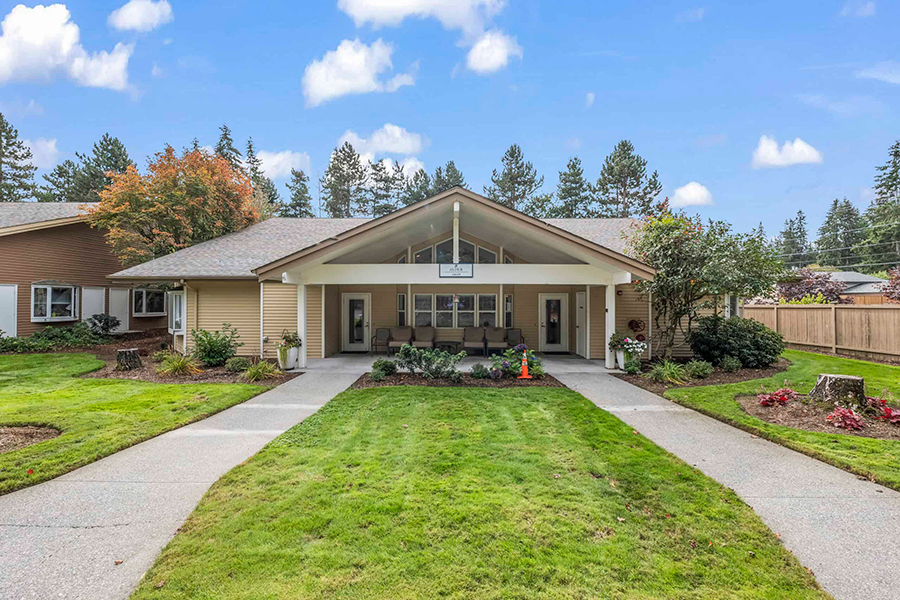 Modern building with landscaped yard and inviting entrance.