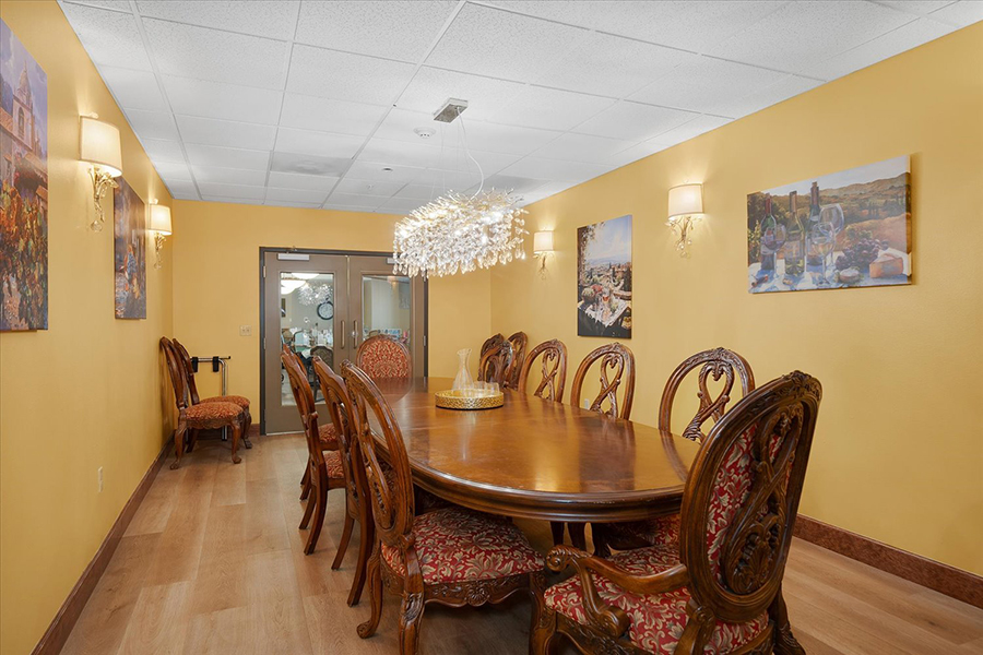 Elegant dining room with decorative chairs and soft lighting.