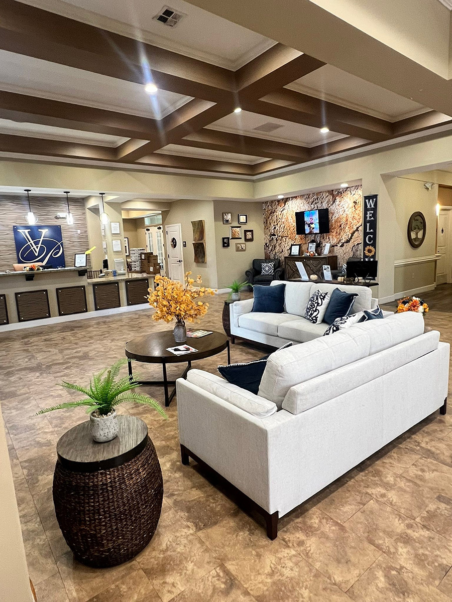 Modern lobby with seating, artwork, and welcoming ambiance.