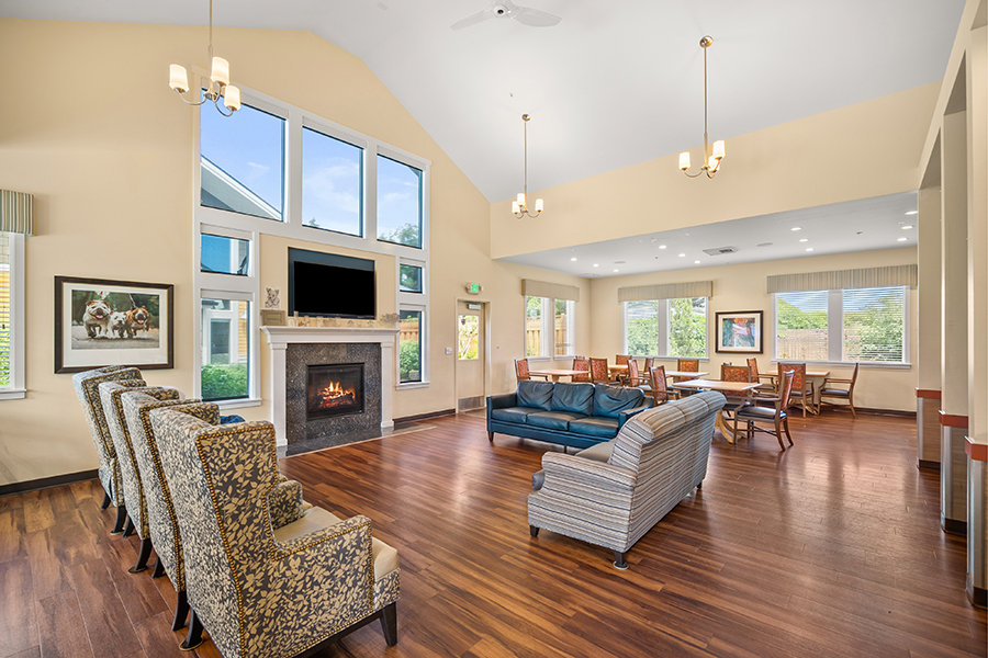 Spacious, well-lit common area with comfortable seating arrangements.