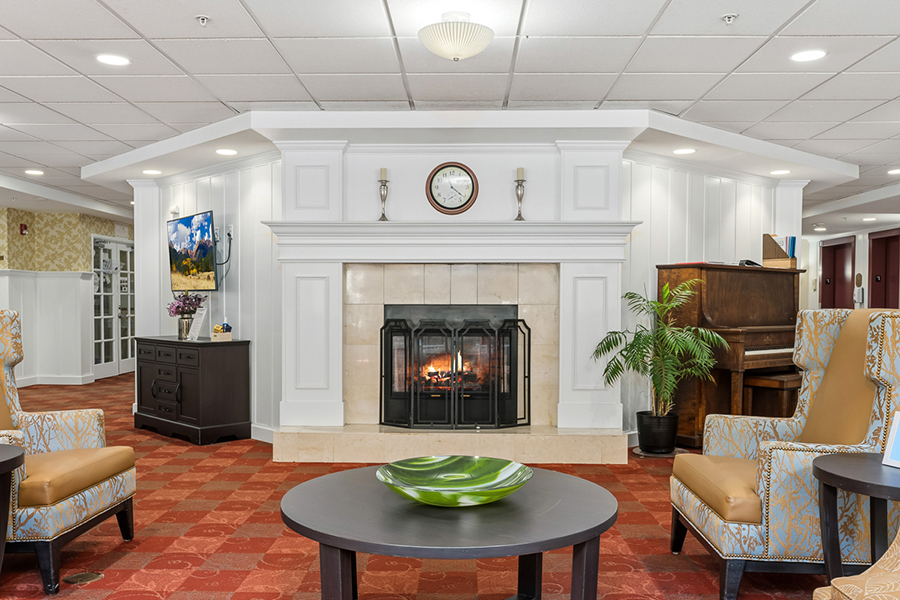 Cozy lounge area with fireplace and comfortable seating.