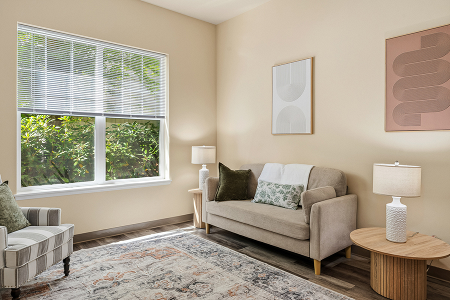 Cozy living room with natural light and modern decor.