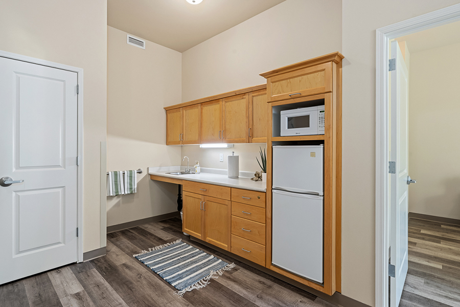 Bright kitchen with wooden cabinets and modern appliances.