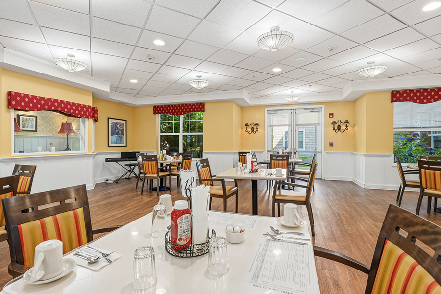 Bright dining area with colorful decor and tables set.