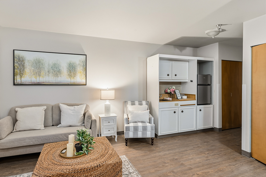 Cozy living space with modern furniture and warm decor.