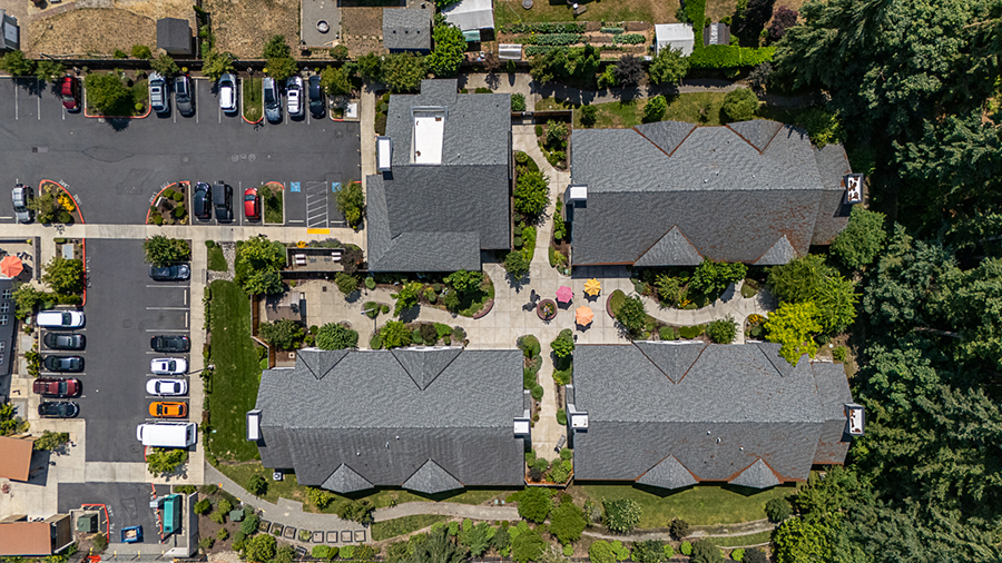 Aerial view of clustered buildings and landscaped gardens.