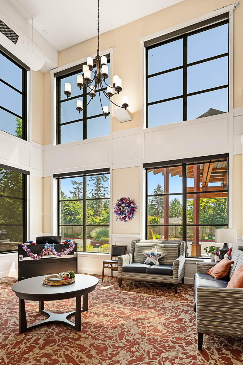 Bright, cozy living space with large windows and stylish decor.