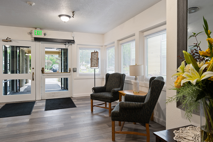 Welcoming entrance with seating, windows, and decorative elements.