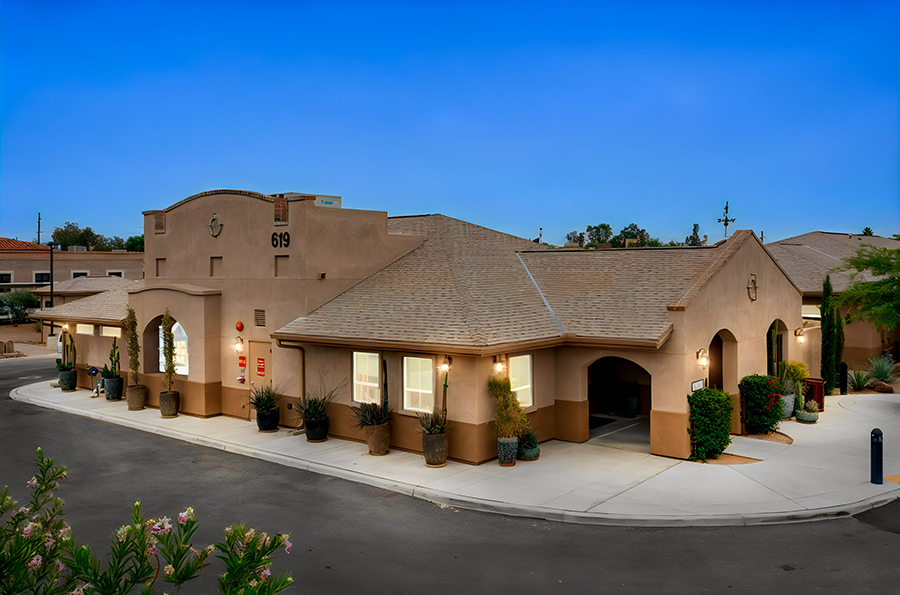 Stuart building with southwestern architecture and landscaping.
