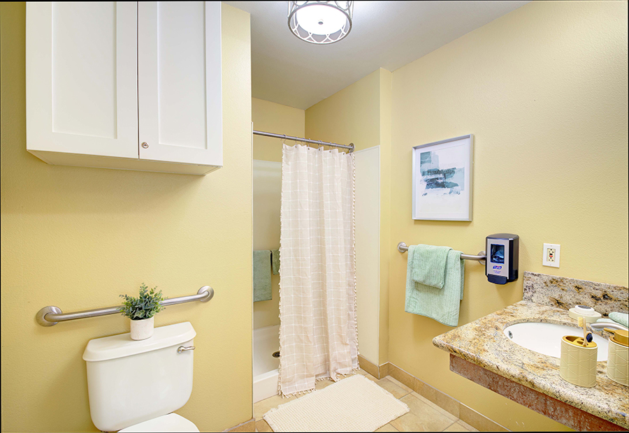 Bright, clean bathroom with simple decor and modern fixtures.