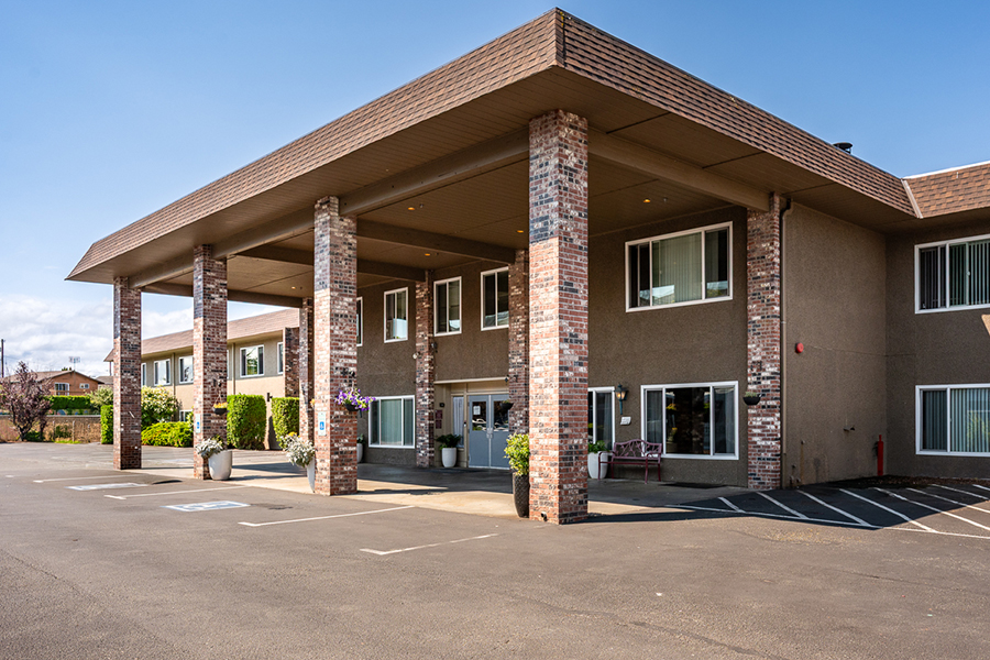 A modern building with columns and large windows.