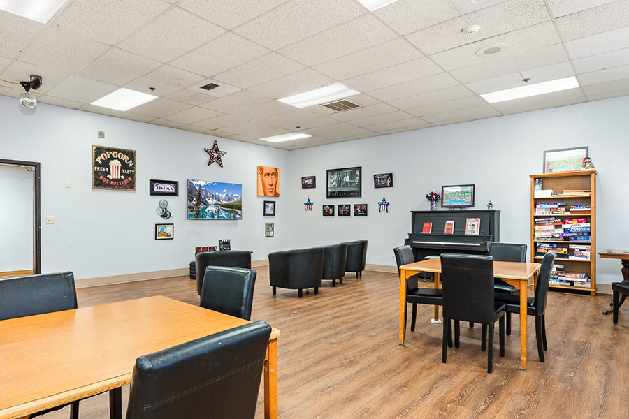 Spacious room with seating, decorations, and entertainment options.