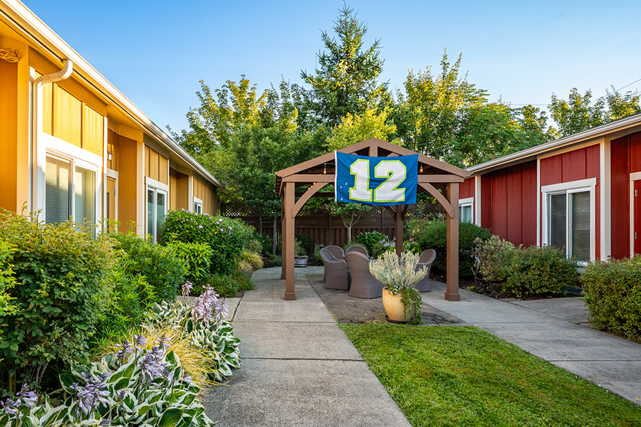 Colorful courtyard with seating and a flag.