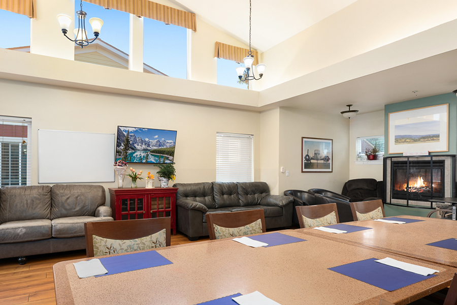 Spacious living area with comfortable seating and TV.