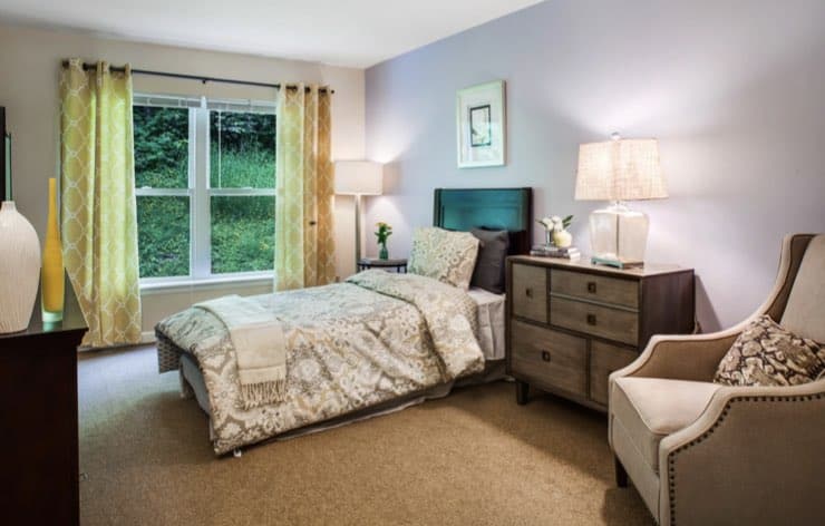 Cozy bedroom with natural light and warm colors.