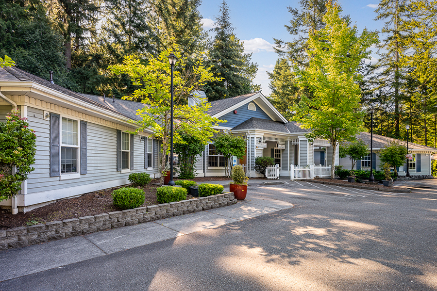 Charming building surrounded by lush greenery and trees.