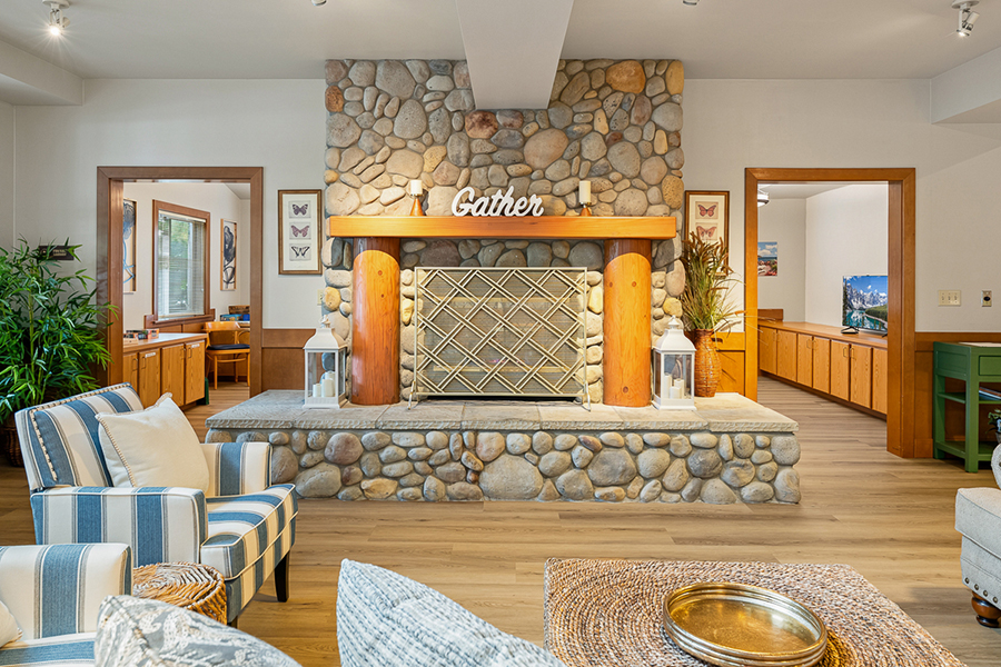Cozy living room with stone fireplace and inviting decor.