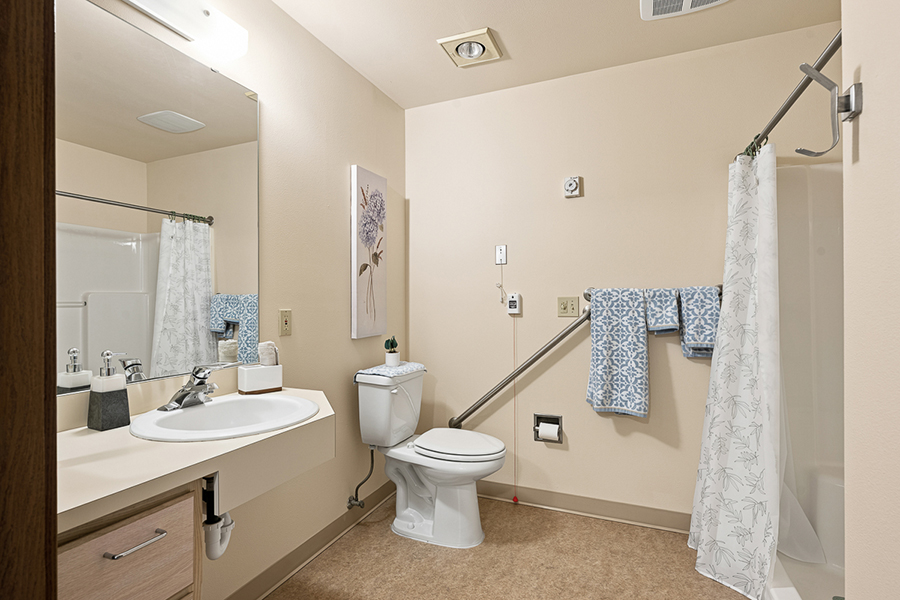 Clean, simple bathroom with essential fixtures and decor.