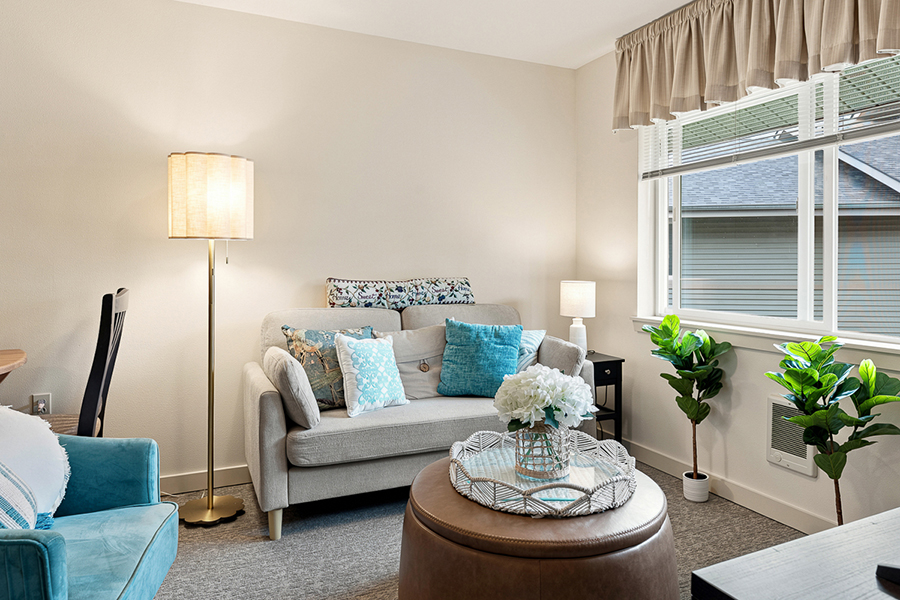 Cozy living room with light colors and decorative accents.