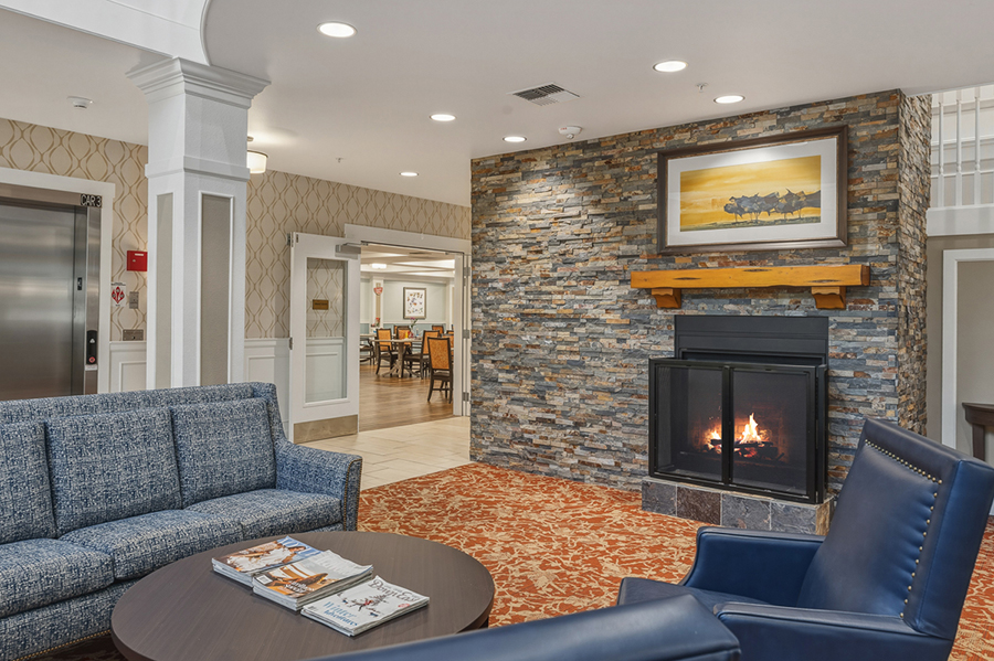 Cozy lounge area with a fireplace and comfortable seating.