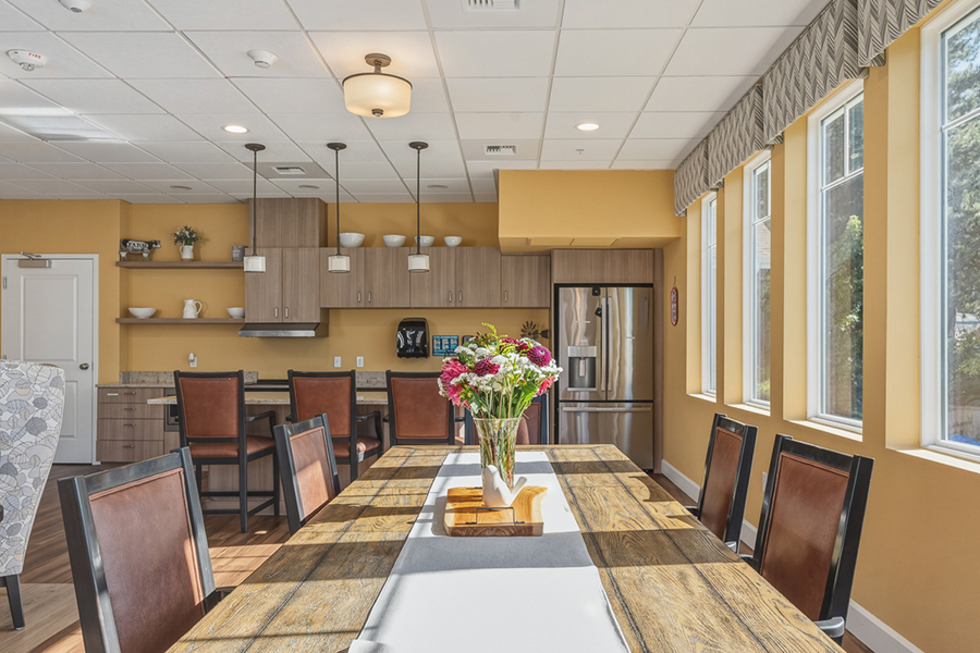 Modern kitchen and dining area with bright, inviting decor.