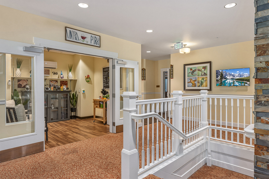 Bright, welcoming hallway with seating and decorative elements.