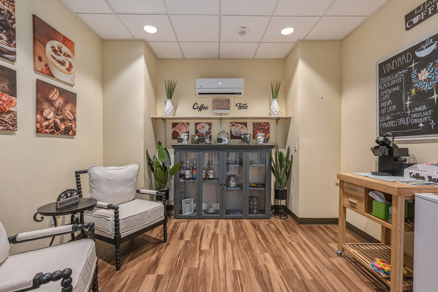 Cozy coffee area with seating and decoration.