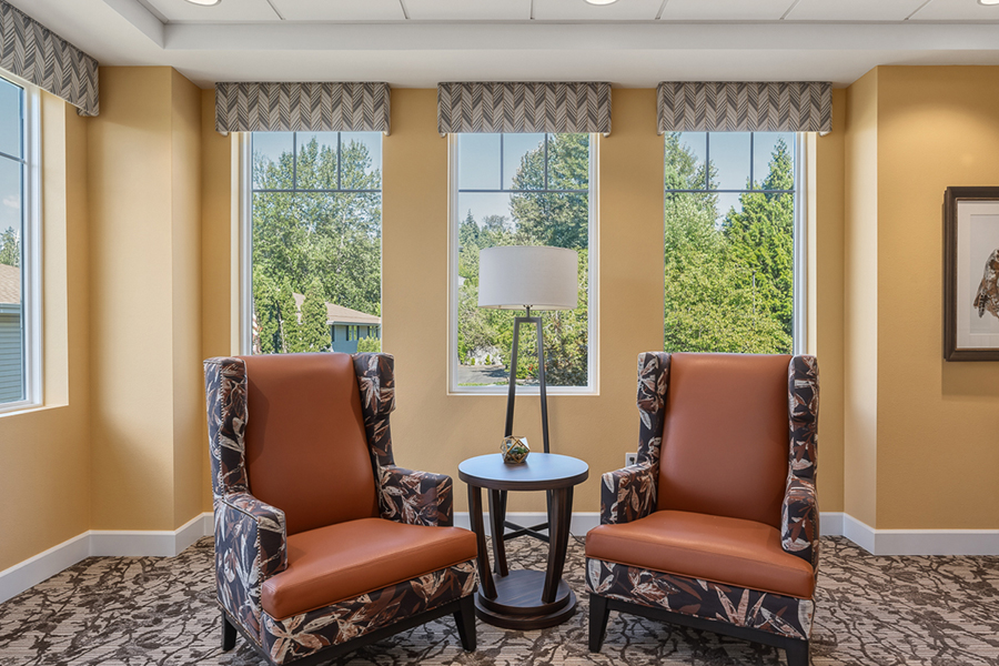 Cozy seating area with windows and natural light.