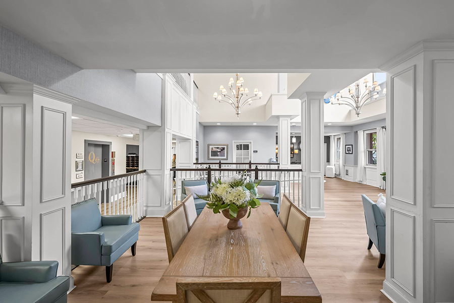 Bright, modern interior with plants and elegant lighting fixtures.