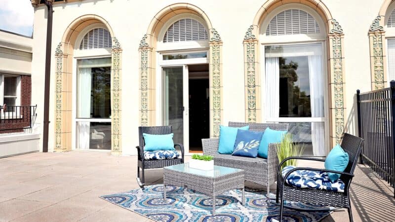 Stylish patio with seating, plants, and decorative elements.