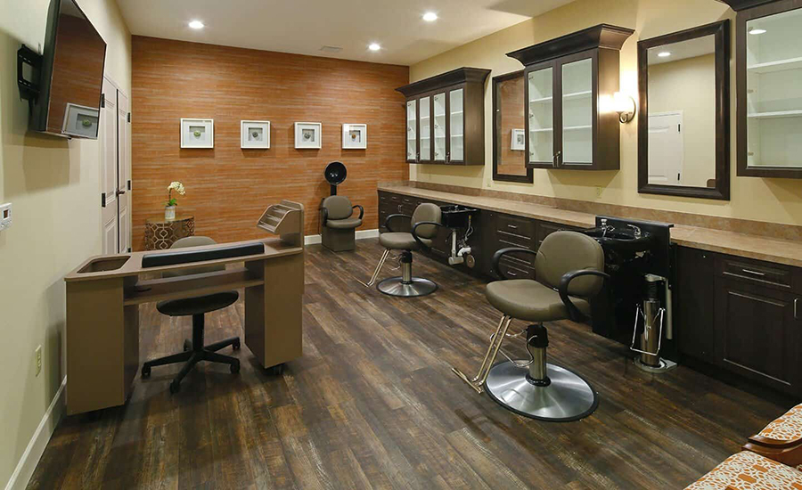 Modern hair salon with styling stations and decorative accents.