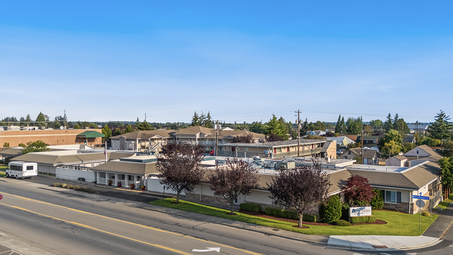 Residential area with buildings and clear blue sky.