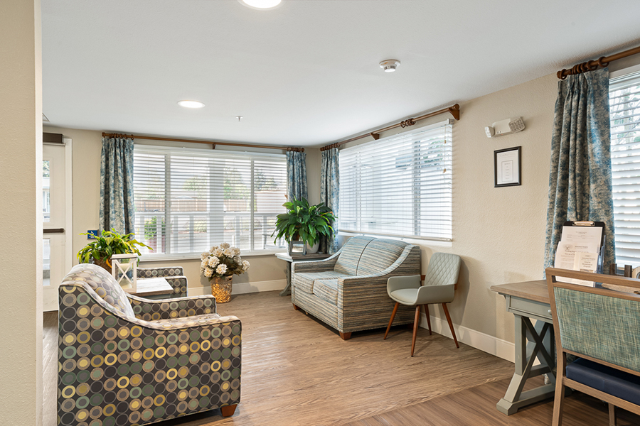 Cozy waiting area with comfortable seating and natural light.