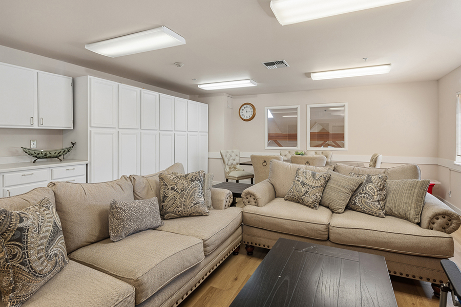 Cozy living area with comfortable sofas and light decor.