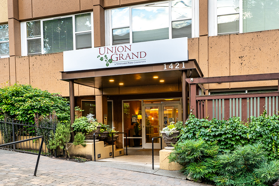 Entrance of Union Grand community with greenery surroundings.