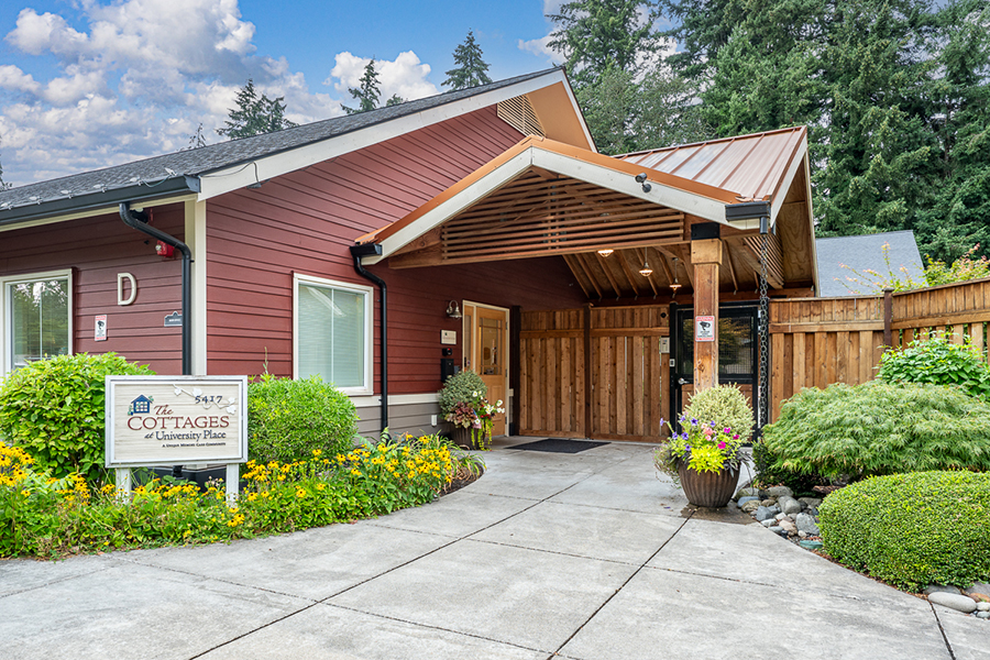 Welcoming entrance to a cottage-style building in nature.