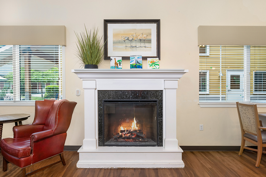 Cozy living space with a fireplace and artwork decor.