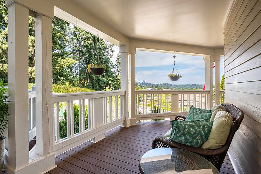 Cozy porch with scenic view and comfortable seating.