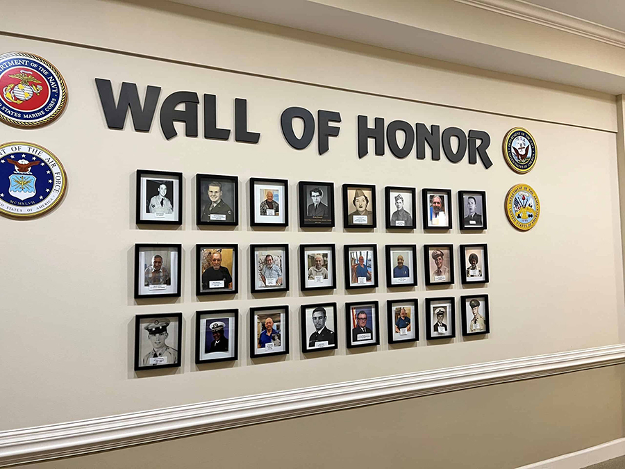 Gallery displaying framed portraits labeled "Wall of Honor."
