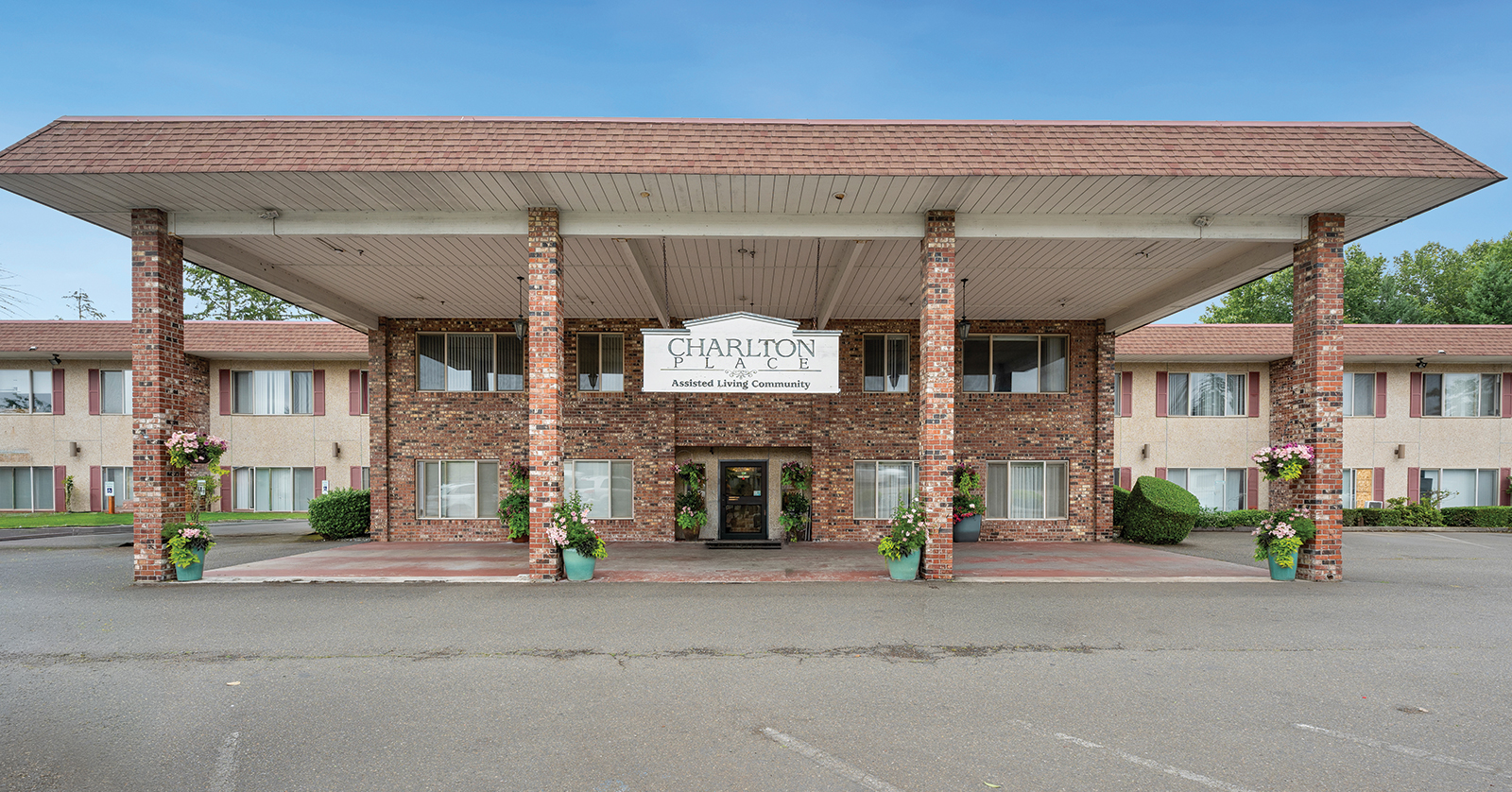 Assisted living community building with welcoming entrance.