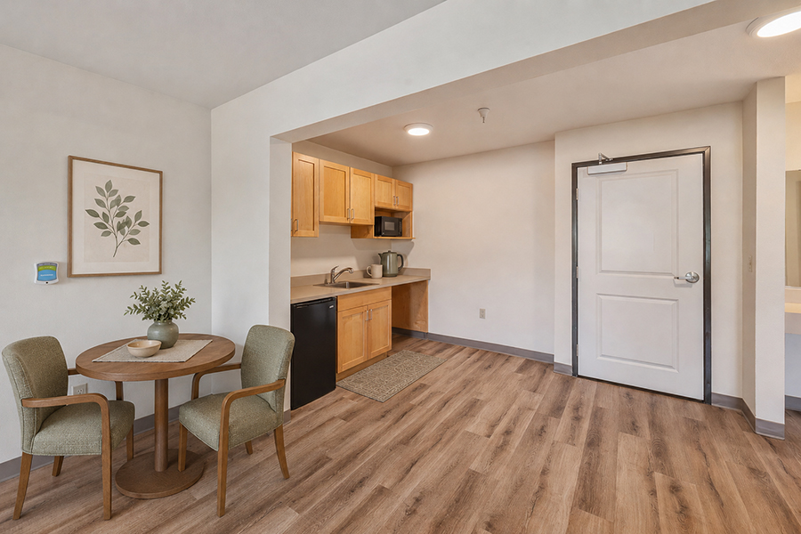 Cozy kitchenette and dining area in modern decor.