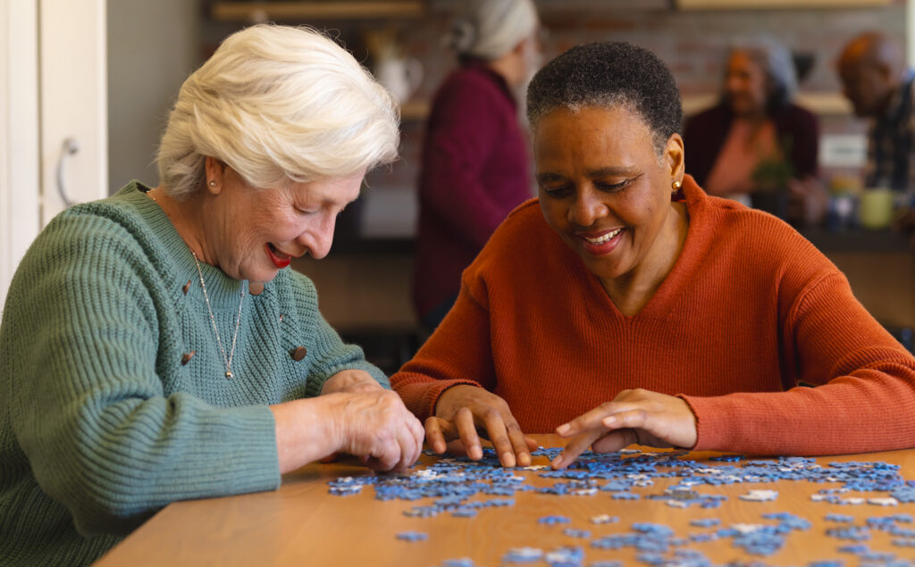 Senior friends doing puzzle together