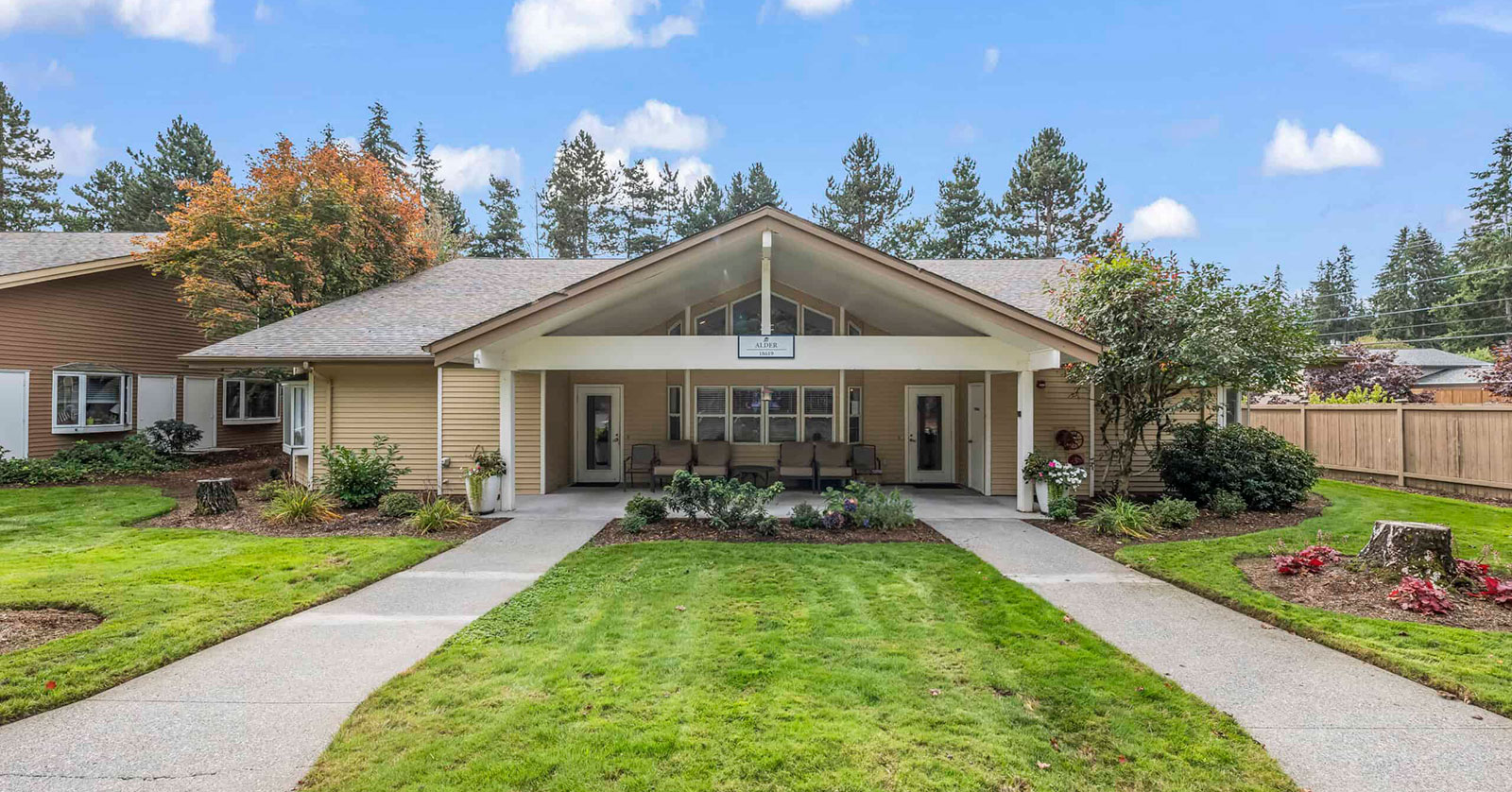 Modern building with landscaped yard and inviting entrance.