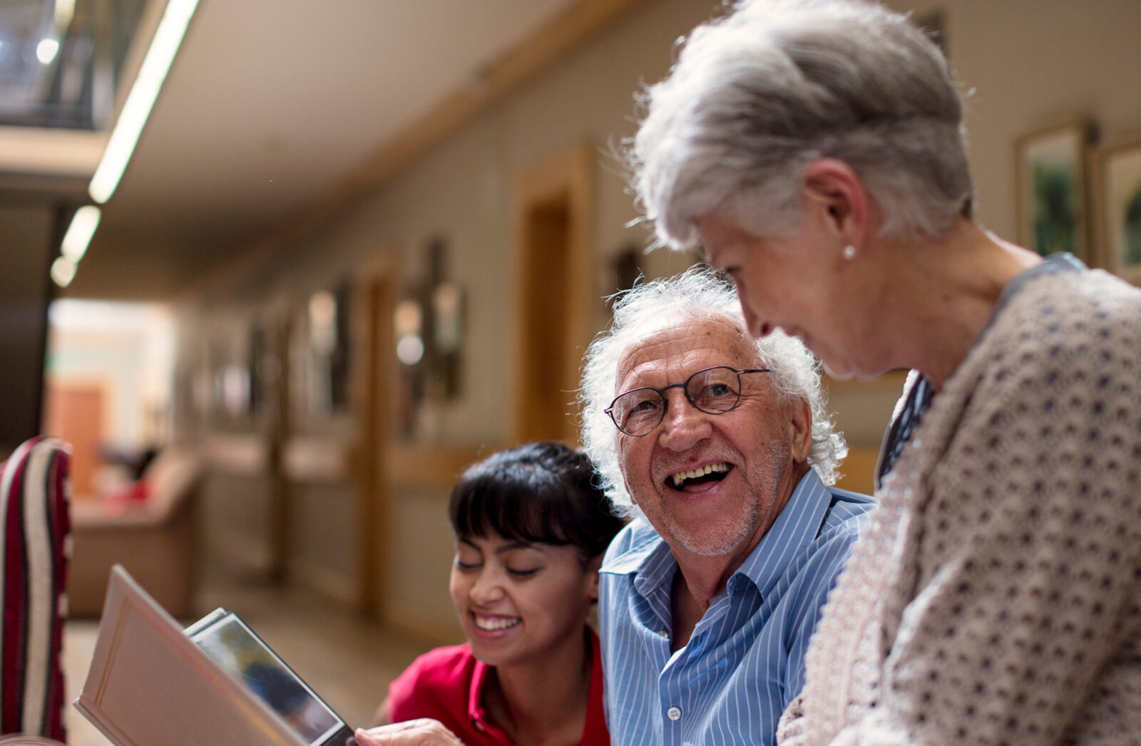 Seniors with caregiver share happy moments together